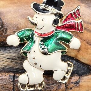 SFJ Skating Snowman Brooch Gold Tone w/ White Green Red Black Enamel  🎄 ⛄️